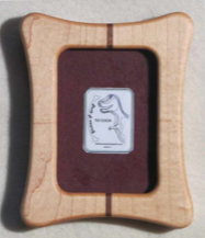 Rectangular frame with oval opening Hard Maple Beautifully handcrafted wooden frame 4" long x 5" high x 3/4" wide Sawtooth on the back for hanging Two drilled hanger holes in the back of the frame for hanging Four movable tabs allow access to change out photographs