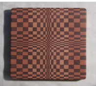Self healing wooden cutting board in geometric pattern Walnut and Hard Maple wood Beautifully handcrafted wooden cutting board Bathed in mineral oil and finished with Beeswax Four rubber feet to help protect countertop Food Safe 8 1/2" long x 8 1/2" wide x 1" high
