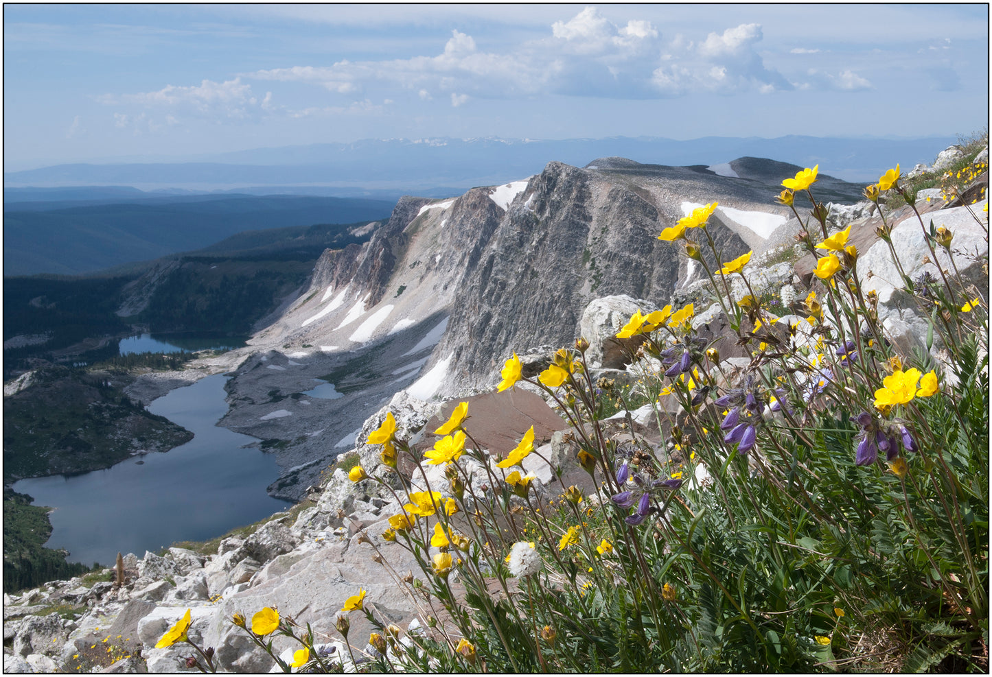 View from the top of medicine bow peak in the Snowy Range mountains Lookout lake visible at the bottom of the mountain