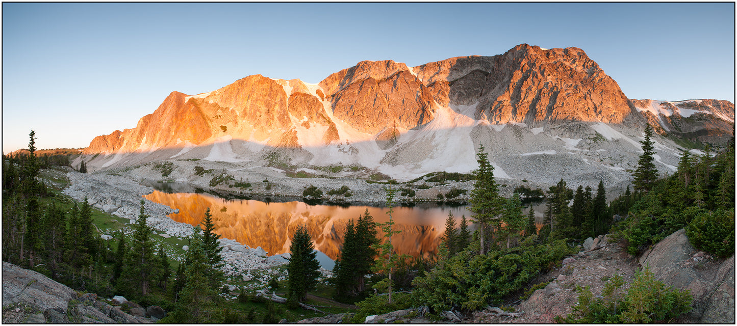 " Lookout Lake at Sunrise " Photography Print Artist: Rick Walters Snowy Range Mountains at sunrise Morning reflection captured in a still lake Beautiful view of Lookout Lake in the Snowy Range Mountains 14" long x 5.5" wide Printed on classic photo paper using archival pigment ink In plastic sleeve and on foam board for protection