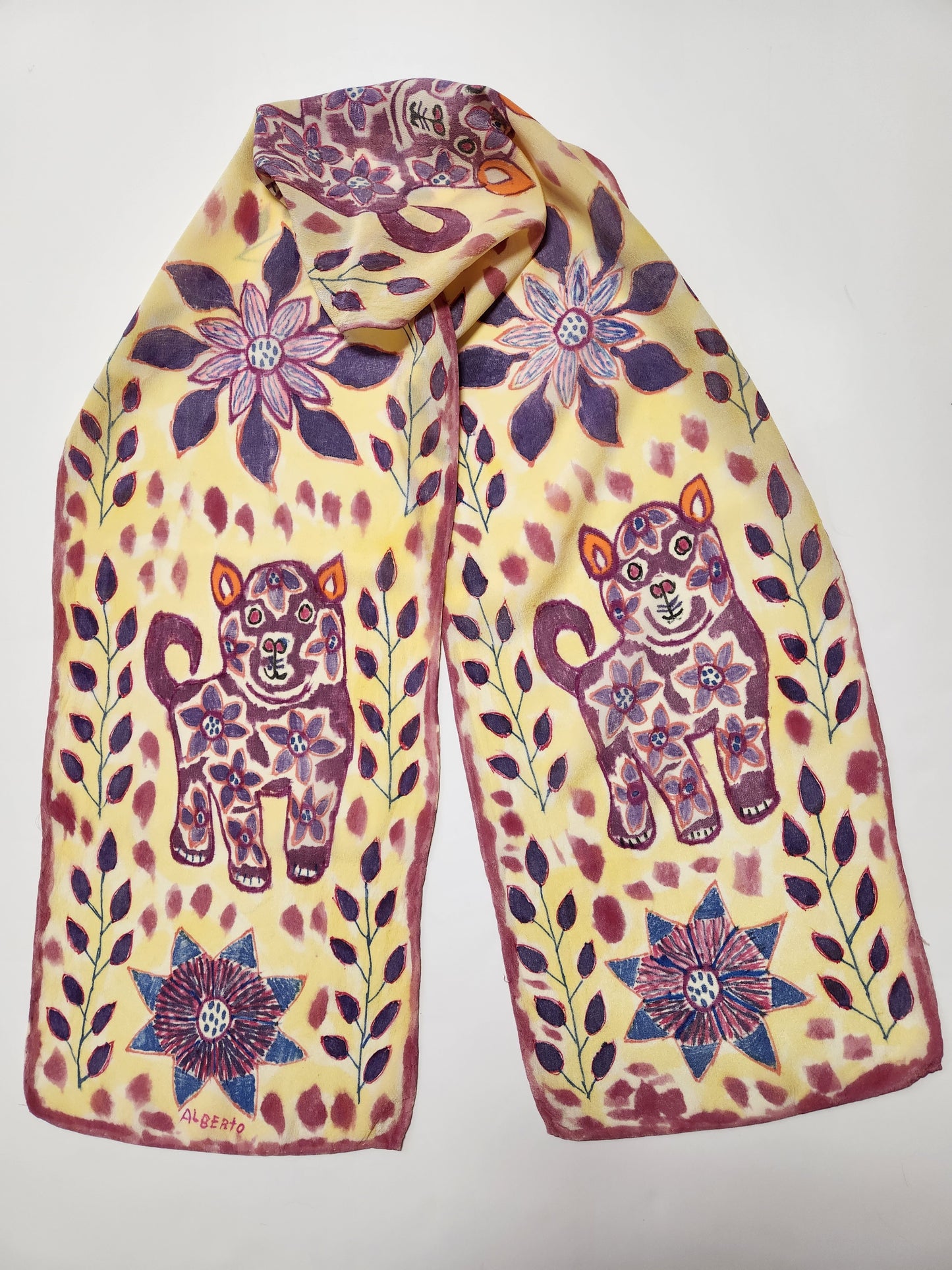 <h1>Original Fiber Art Silk Scarf</h1> <h1>of " Three Cats - Four Flowers "<br></h1> <h1><br></h1> <h2>Artist: Alberto Alcantara</h2> <p>Hand dyed</p> <p>Original pen art on fiber</p> <p>Peruvian Folk Art Original</p> <p>Silk Art Scarf <br></p> <p>Three Cats</p> <p>Four Flowers</p> <p>Original Art to enjoy and wear<br></p> <p>Natural fiber</p> <p>Fiber Original</p> <p>11" x 60 "<br></p> <p> </p>