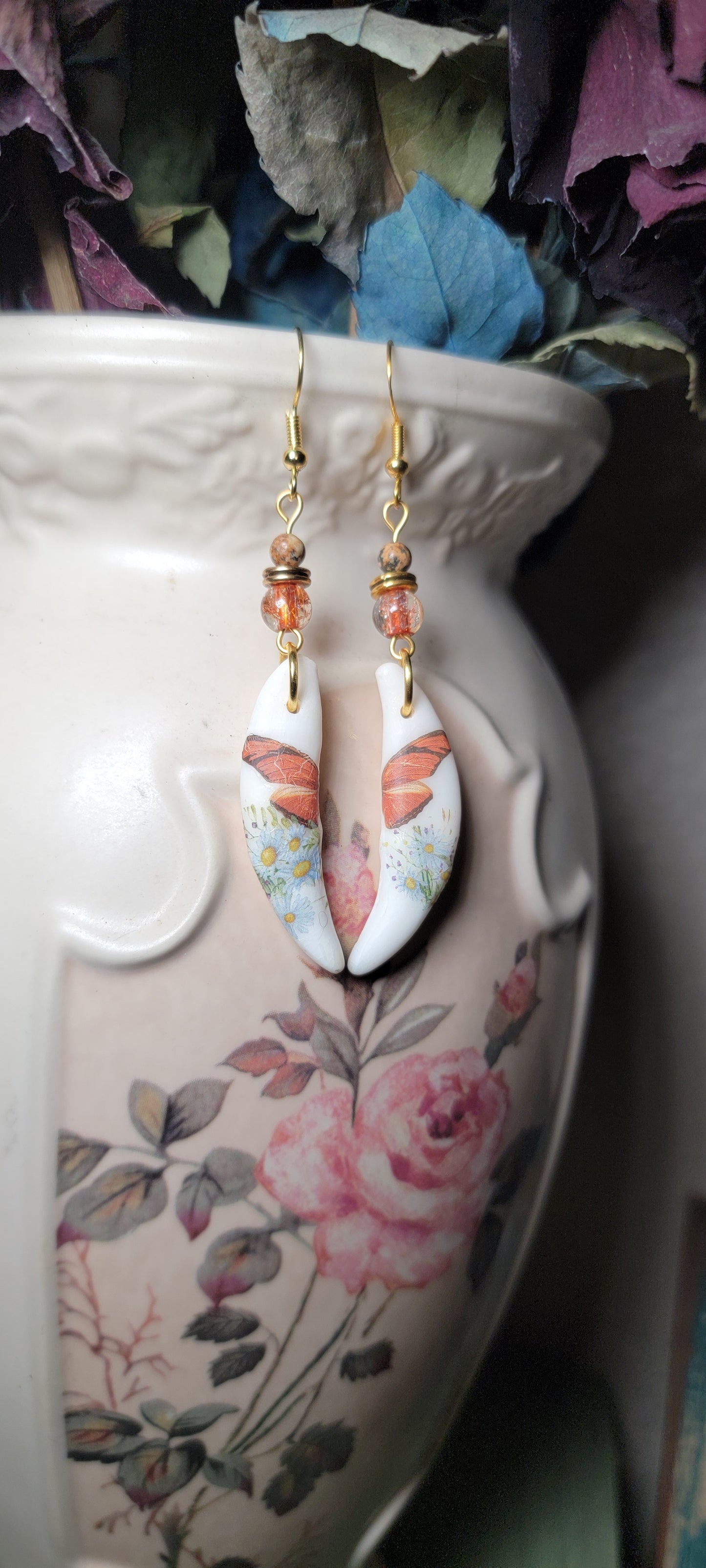 Earrings - Coyote Fang W/ Butterfly Wing Decor
