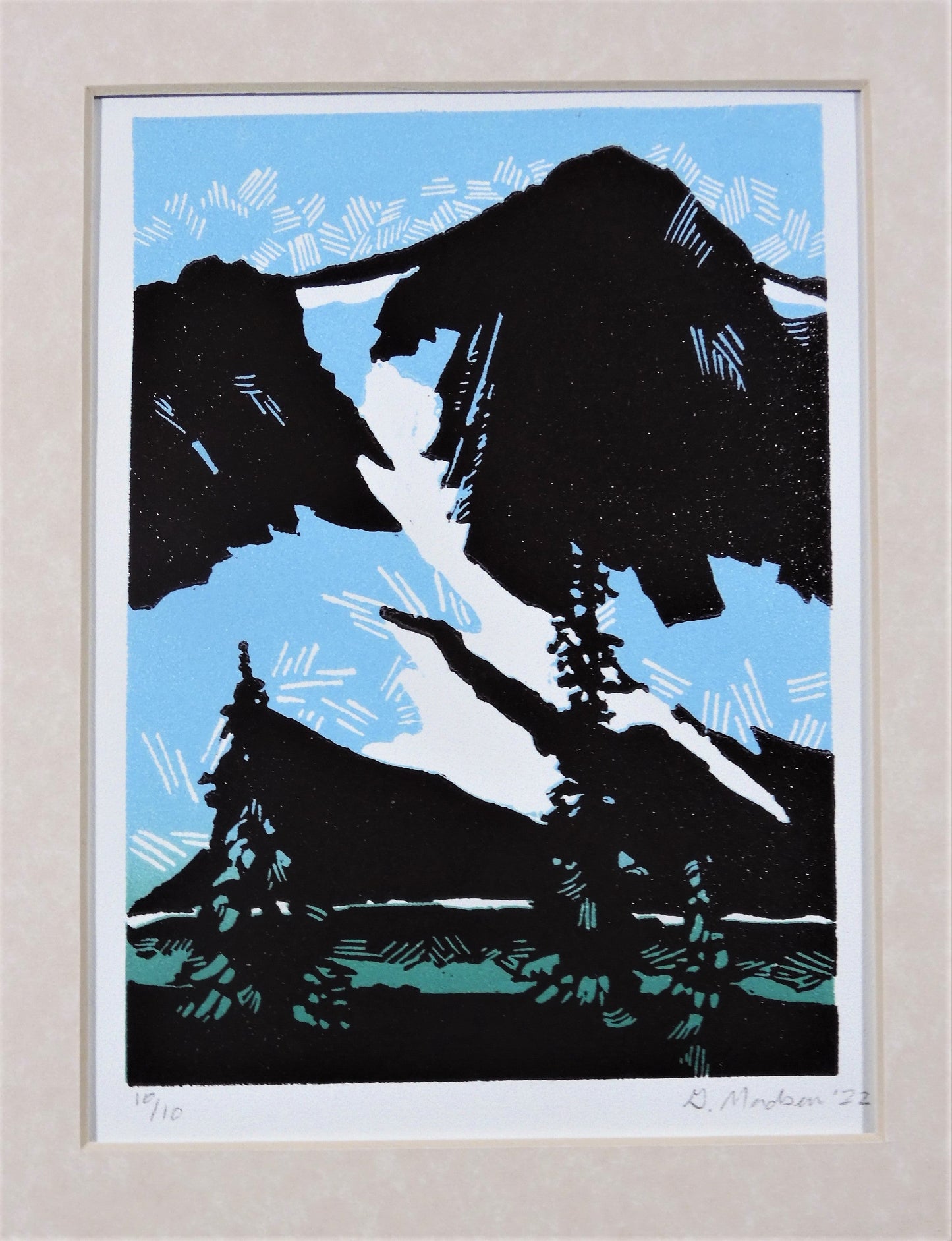 " Early Spring " Mountains Relief Print. Artist: Ginny Madsen 7.0" wide x 5.0 " high relief print size Matted in 1.75" marbled tan mat Print # 10/10 - 2022 From the artist: Early Spring In this print I was specifically simplifying the complexities of rock faces and forest using large shapes and linear marks. It is interesting to play with what illusions can be made with the marks carving tools will create.