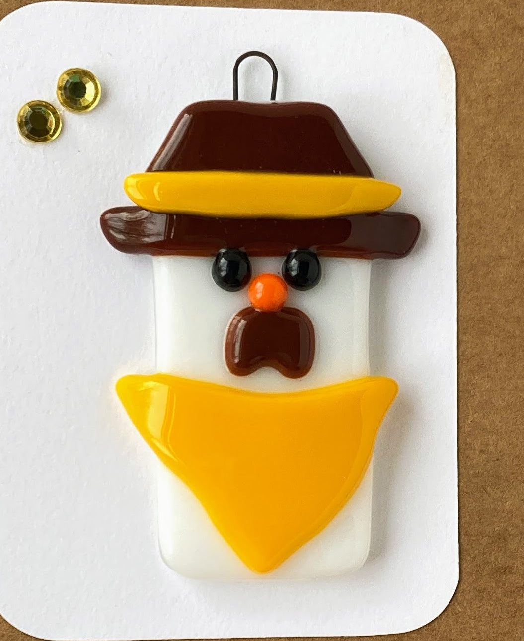 Fused Glass Christmas Ornament Snowman cowboy with brown hat with gold stripe Yellow Scarf 2' wide 2' long 0.25 high ornament Included is a 5" x 7" blank Kraft paper card with envelope A perfect gift for the holidays or for any pokes fan
