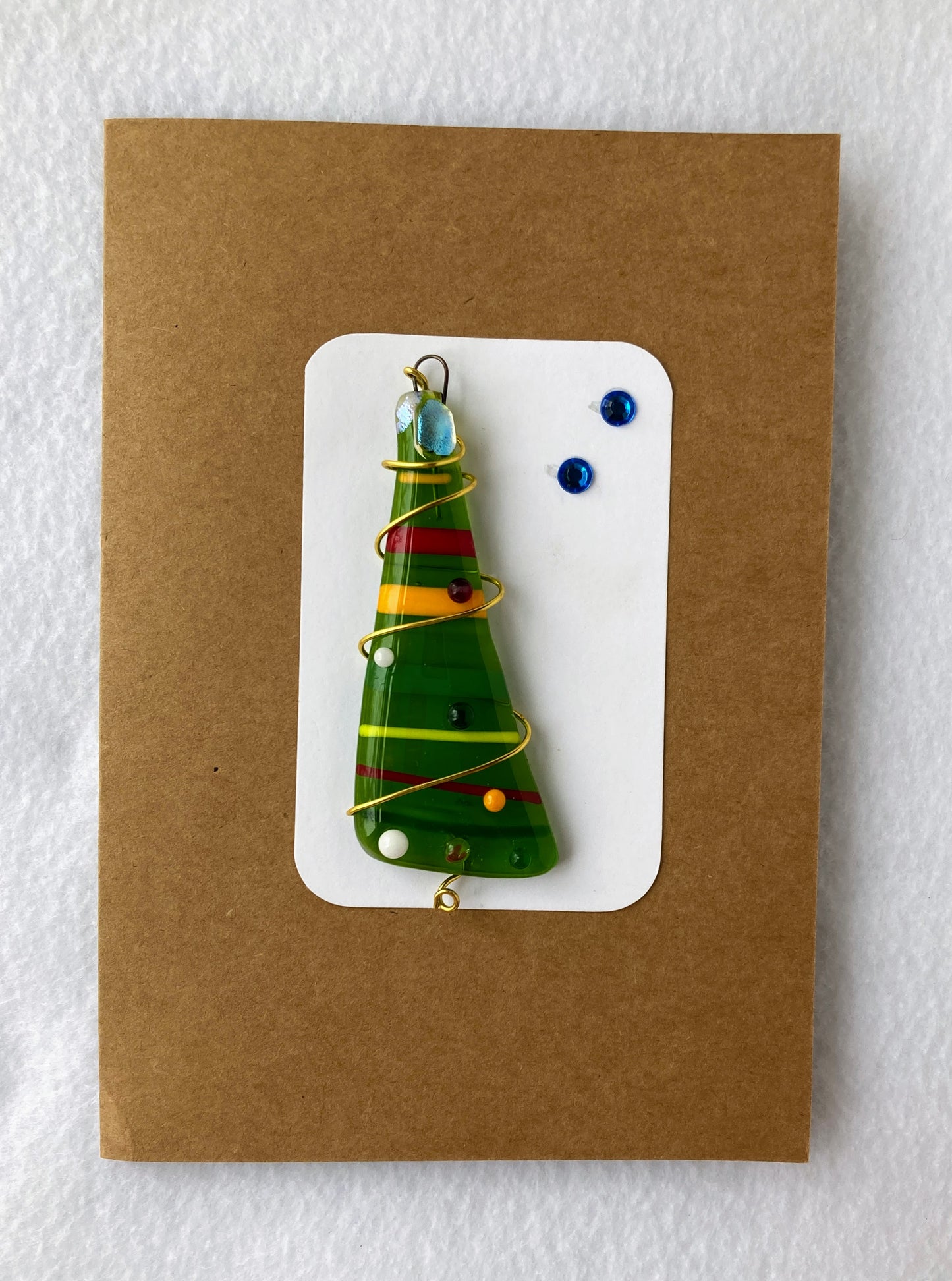Fused Glass Ornament and card Light green Christmas Tree with red, green and yellow stripes Red wire wrapping gives the looks of festive tinsel Small glass dot ornaments Copper wire wraps around tree