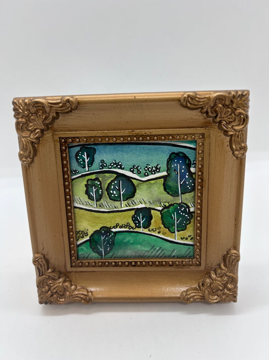 Original miniature watercolor and Ink   7 trees line a green path  The shade would be wonderful in the summertime  Framed in a gold colored resin frame   Easel back allows to display on a table or shelf   4" long x 4" high x .5" wide   Signed by the artist