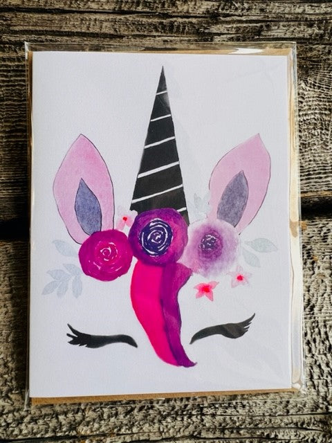 Floral Unicorn Head Watercolor 4 Card Pack Artist: Lisa Edwards  Watercolor painting of flowers and shapes making a Unicorn head  4 Blank Card pack   Kraft envelopes included   5 1/2" long x 4 1/4" wide  Unique card for family or friends