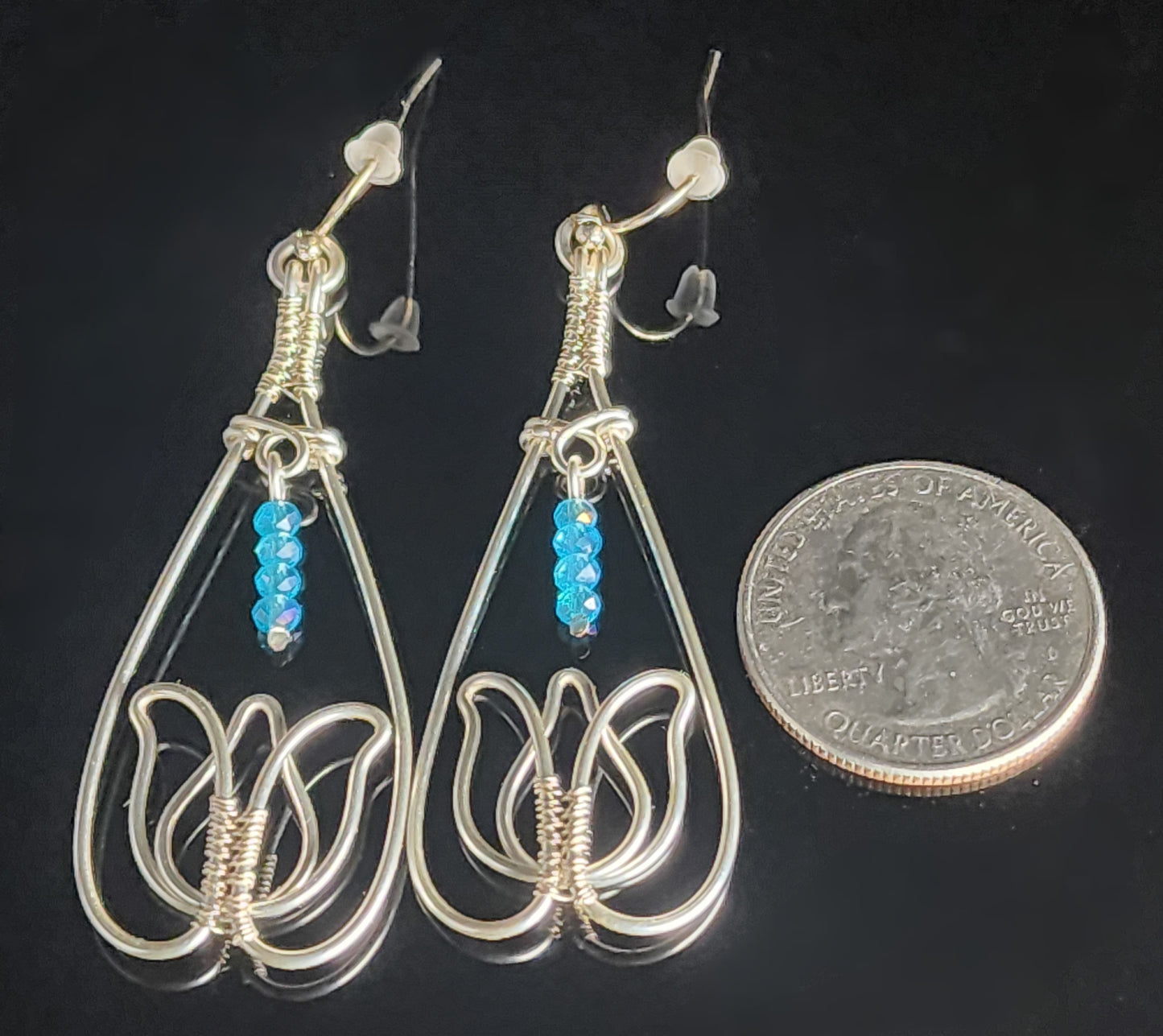 Teardrop with Tulip shape at the bottom High end blue beads hang above the tulip flower Copper ear wires 2.16" long x .84" wide