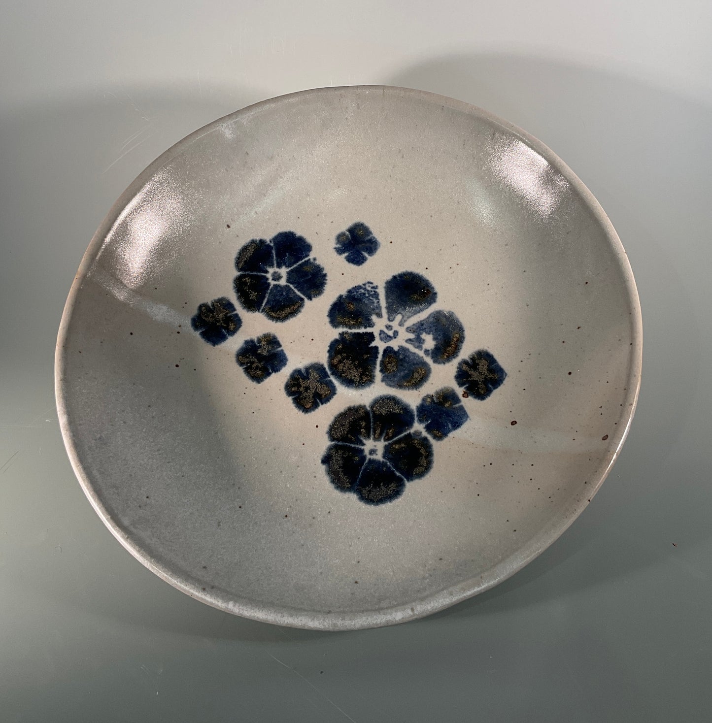 Hand thrown stoneware bowl Gray glaze with blue flowers 11" across x 3" tall Beautiful serving dish for any occasion