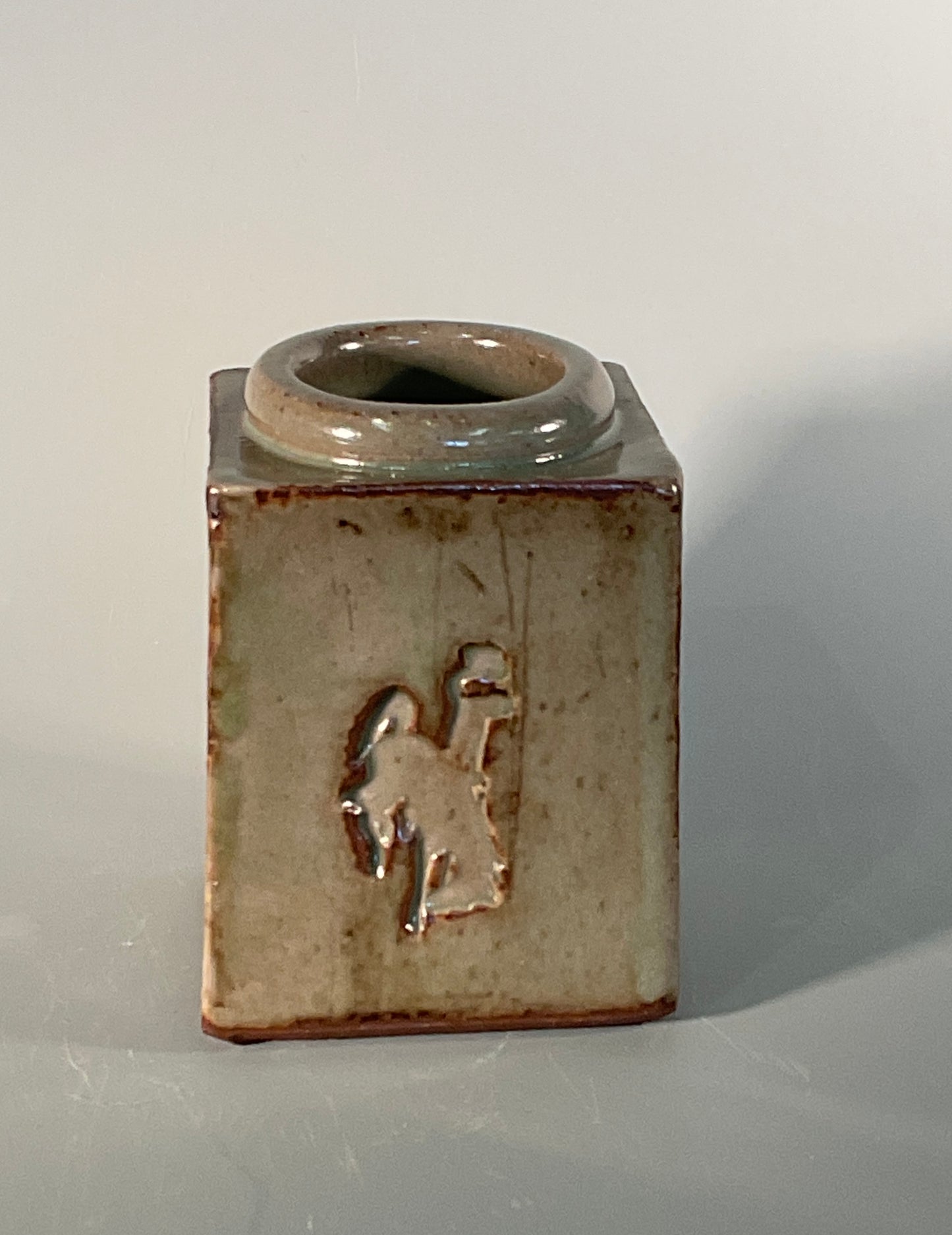 Hand thrown stoneware  Square shape with greenish color  Great for flower display or as a table center peice