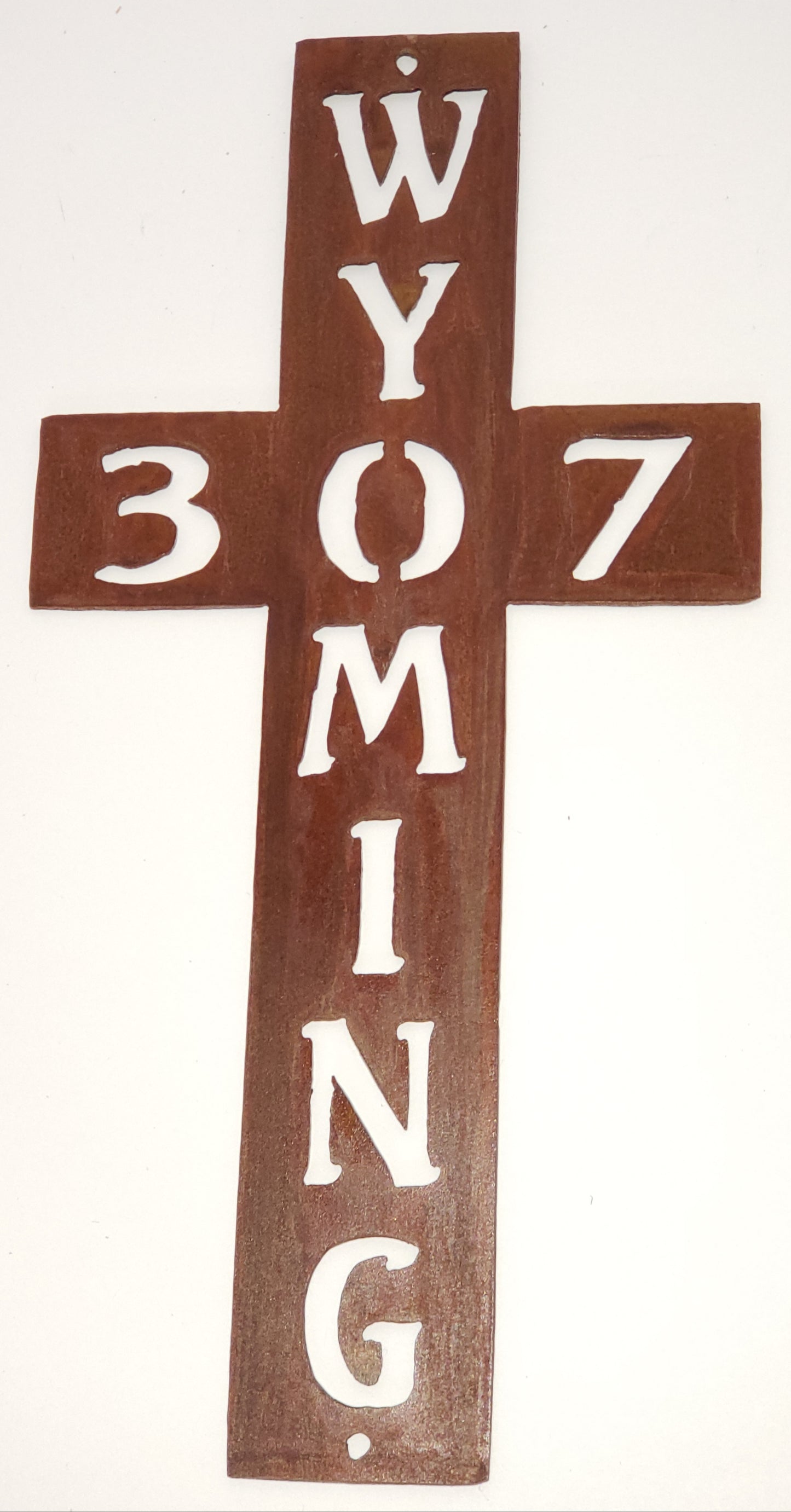 Large metal cross with Wyoming going down the cross and 307 across the cross. The O and the 0 are used as the same.