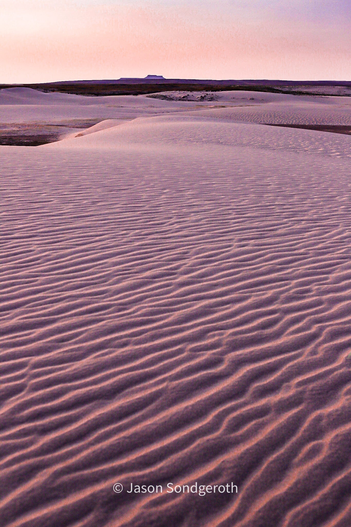 Sunrise at Table Mountain in the Red Desert, Wyoming by photographer, Jason SondgerothNorth Table Mountain Sunrise, Red Desert Jason Sondgeroth, Artist Photograph Ready for a frame of your choice Table Mountain in the background 12" X 8" Card stock for support Clear, plastic sleeve for protection Near Alta, Wyoming Table Mountain's summit sits along the border between Jedediah Smith Wilderness and Grand Teton National Park This is a very popular area for backpacking, camping, and hiking,