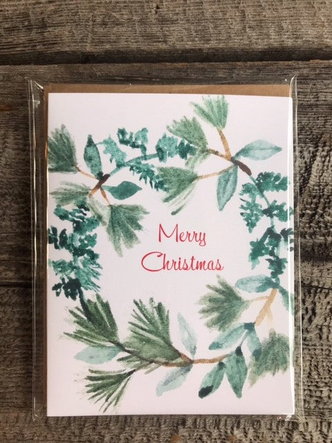 Merry Christmas Wreath Watercolor Greeting Card Package Photographer: Lisa Edwards Green wreath with the words Merry Christmas in middle of wreath Four pack of cards with brown envelopes Nice for Christmas cards for all Blank card Envelope included 4" wide x 5.5" long