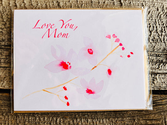 <h1>" Love You, Mom " Greeting Card</h1> <h2>Artist: Lisa Edwards</h2> <p data-mce-fragment="1">From an original watercolor painting by the artist<br data-mce-fragment="1"></p> <p data-mce-fragment="1">Love You, Mom with Cherry Blossoms<br data-mce-fragment="1"></p> <p data-mce-fragment="1">Blank Card with Kraft envelope included for each card<br data-mce-fragment="1"></p> <p data-mce-fragment="1">5 1/2" long x 4 1/4" wide</p> <strong>Single Card</strong><br> 
