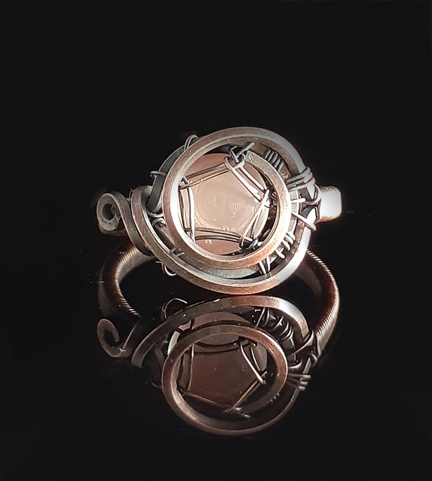 Cherry Quartz stone hand wrapped in oxidized copper. Ring is size 5