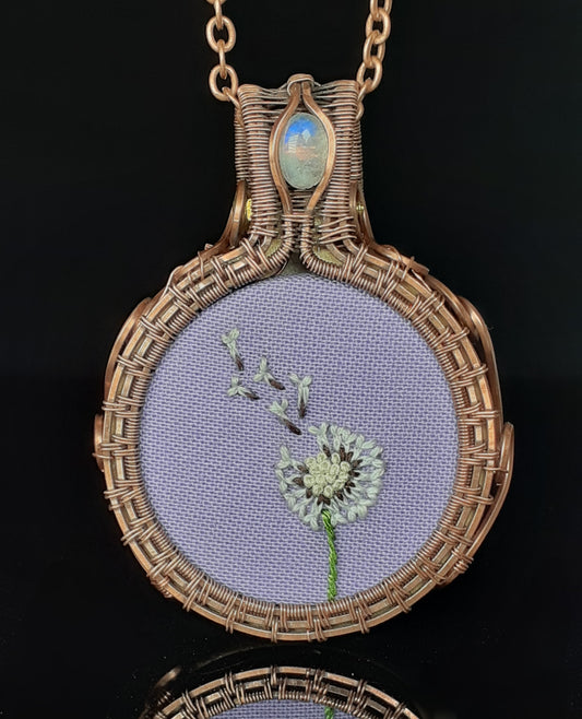 polished copper wire wrapped around a hand embroidered dandelion