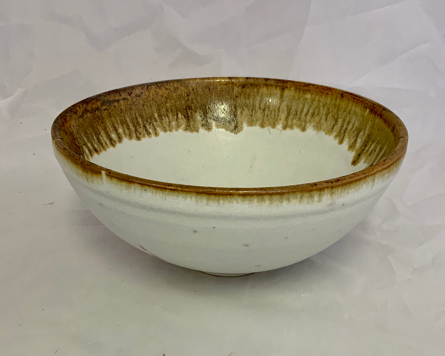 White with Ochre Rim Stoneware Bowl Muffy Moore Ceramic Potter White with ochre rim Stoneware 7" wide x 3.5" tall White Ochre accent Great for berries and other
