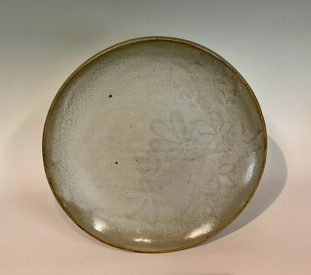 White Winter Leaves 11" Stoneware Plate - White Winter Leaves 11" Stoneware Plate Muffy Moore: Ceramic Potter Hand thrown stoneware plate Gray glaze with white winter leaves 11" across x 1 1/2" tall Will make a large dinner plate or smaller platter