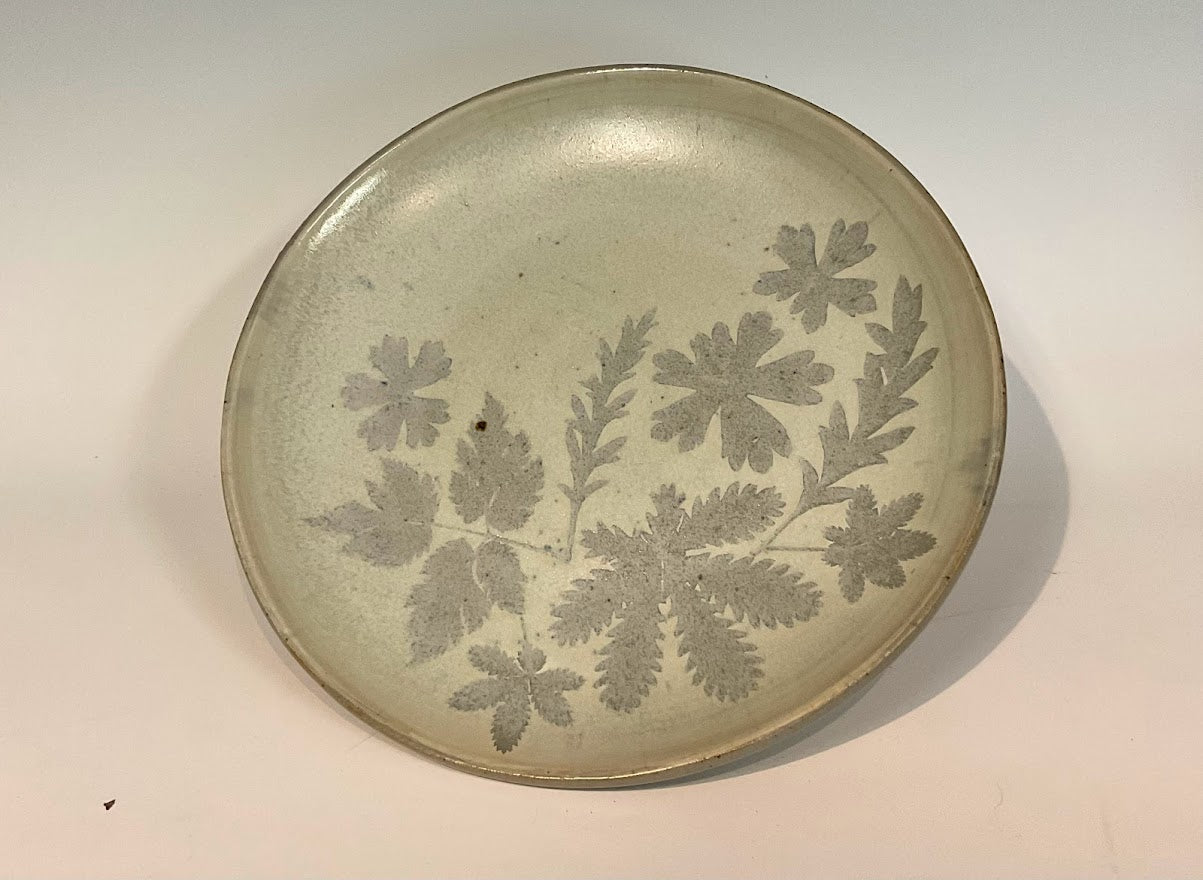 Wyoming Leaves Gray Glaze 11" Stoneware Plate Muffy Moore: Ceramic Potter Hand thrown stoneware plate Gray glaze with Wyoming leaf pattern 11" across x 1 1/2" tall Will make a large dinner plate or small serving platter