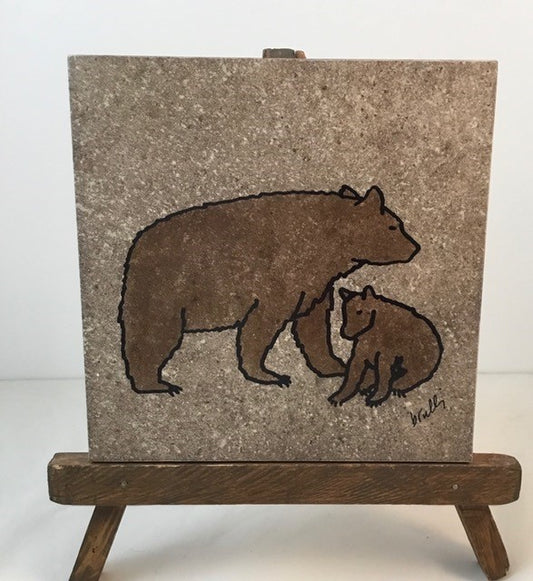 Bear Trivet Artist: Elizabeth Rulli A recycled trivet from Habitat for Humanity  Restore with a Indian Paintbrush hand paint on trivet  Wood bottom with felt pads on bottom coroners  Hand painted and fired to 1375 degrees and will clean with scouring power if a pan leaves a mark  Bear is painted on each trivet