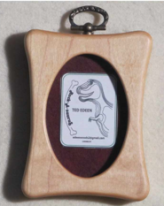 Rectangular frame with oval opening  Hard Maple  Beautifully handcrafted wooden frame  3" long x 4" high x 3/4" wide  Sawtooth on the back for hanging  Loop in the top of frame may also be used for hanging  Four movable tabs allow access to change out photographs