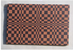 Self healing wooden cutting board in geometric pattern  Purple Heart and Hard Maple wood  Beautifully handcrafted wooden cutting board  Bathed in mineral oil and finished with Beeswax  Four rubber feet to help protect countertop  Food Safe  6" long x 9" wide x 3/4" high