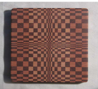 Self healing wooden cutting board in geometric pattern  Walnut and Hard Maple wood  Beautifully handcrafted wooden cutting board  Bathed in mineral oil and finished with Beeswax  Four rubber feet to help protect countertop  Food Safe  8 1/2" long x 8 1/2" wide x 1" high