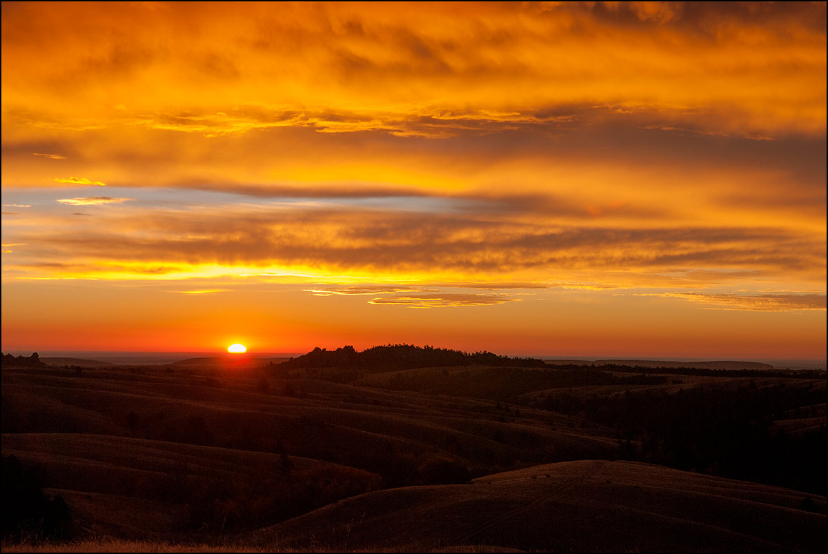 " Sunrise Laramie Range " Photography Print  Artist: Rick Walters  Sunrise in the Laramie Range mountains  Beautiful orange sky over the rock formations  10" long x 8" wide  Printed on classic photo paper using archival pigment ink  In plastic sleeve and on foam board for protection