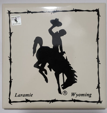  Bucking Horse Coaster Artist: Elizabeth Rulli  4.25" long x 4.25" wide x 3/8" high  White coaster with University of Wyoming's Steamboat logo  Laramie Wyoming along the bottom of coaster .  The cowboy and bucking horse have been the symbol of the University of Wyoming since the early 1900s. Since then, this image has been used on all UW athletics gear and is a symbol of the university. Steamboat defines and embodies the untameable spirit of the state and the University of Wyoming