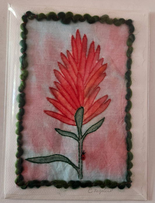 <p>Indian Paint Brush Flower<br></p> <p data-mce-fragment="1">Hand painted and hand dyed fabric with thread embellishments</p> <p data-mce-fragment="1">Little ladybug on the stem<br></p> <p data-mce-fragment="1">Red and blue background with green border</p>