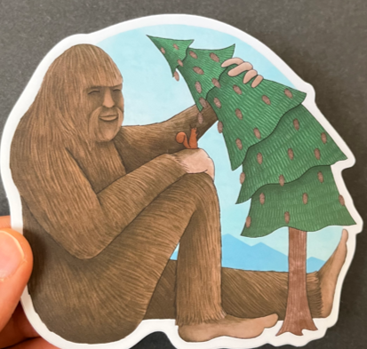 Bigfoot With Squirrel Sticker Artist:  Tara Pappas  Whimsical sticker of a Sasquatch with a squirrel  Bigfoot is bending a pine tree so the squirrel can reach a pine cone  Vinyl sticker  4 1/2" Long x 4" Wide  Would look great on a water bottle or laptop 