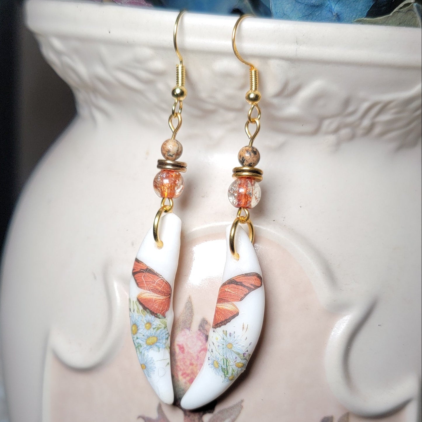 Earrings - Coyote Fang W/ Butterfly Wing Decor