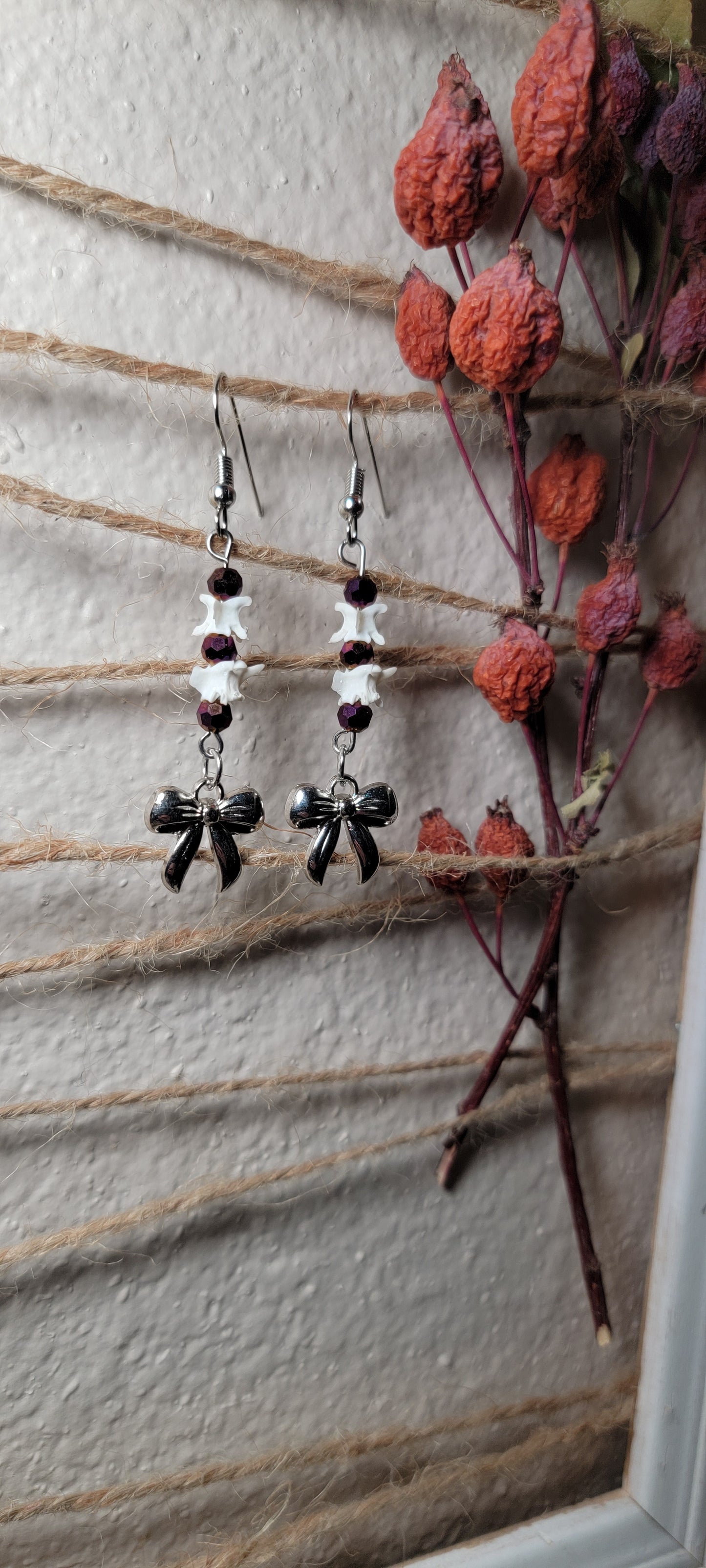 Earrings - Rattlesnake Vertebrae with Purple Beads and Bow Charm