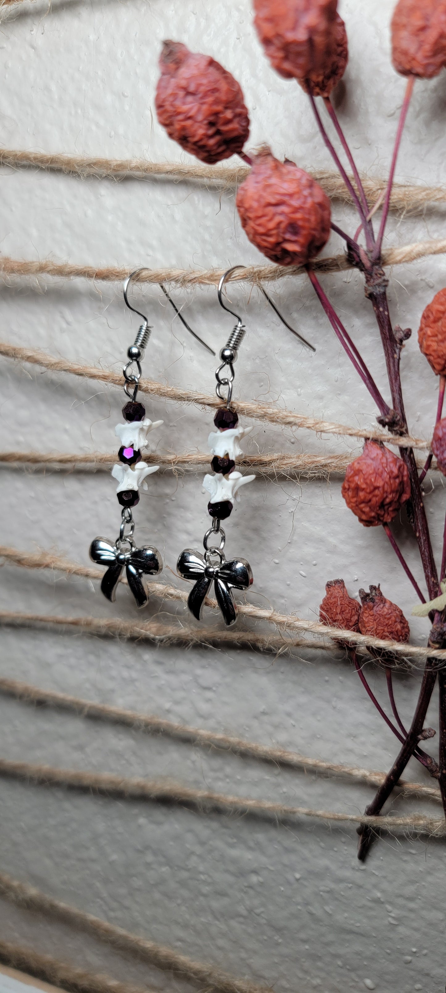 Earrings - Rattlesnake Vertebrae with Purple Beads and Bow Charm