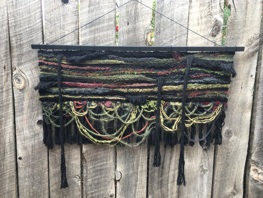 " Myrkvidr #1 Tapestry " Handwoven Tapestry Artist: Erin Abraham  Handwoven Tapestry   34" long x 27" high  Myrkviðr is an Old Norse term for a dark forest. Ancient descriptions of these mysterious places bring to mind the deep, vernal richness and mystery of the Snowy Range Mountains during the Spring months, the time when the bears emerge from their winter slumbers and the Equinox approaches.