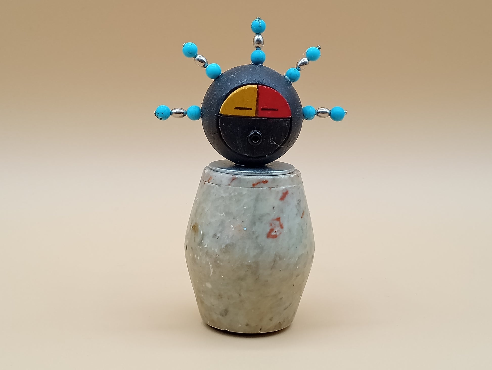 Small stone figure Yellow and red face Silver and turquoise hair