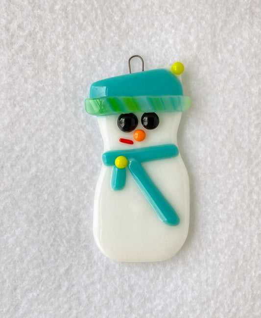  Snowman wearing a light blue hat and scarf  Hat has lime green pom pom  Fused Glass Ornament