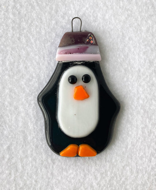 Fused Glass Ornament  Penguin wearing a purple hat with pink trim and a shiny button