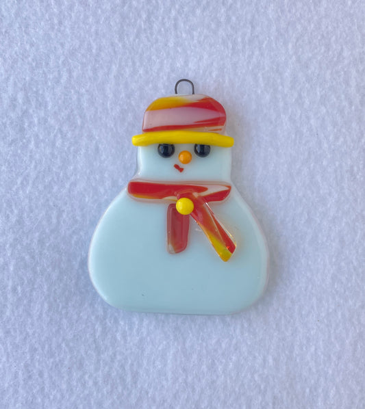  Snowman wearing a red yellow and white hat with yellow trim  Scarf is red yellow and white with a yellow glass dot button  Fused Glass Ornament