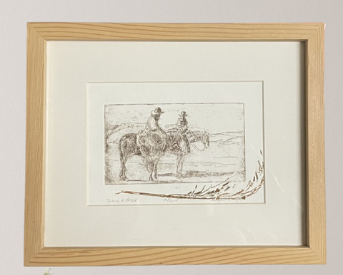 " Taking a Break " Cowboys on Horses Framed Etching Artist: Mary Cunningham  Hours Spent in the saddle, branding, trailing livestock or checking pastures. The cowboy's breakroom is often in the saddle as they take five, share some stories and get ready to go back to work  #19 of a Variable Edition of 30 Original Intaglio Prints