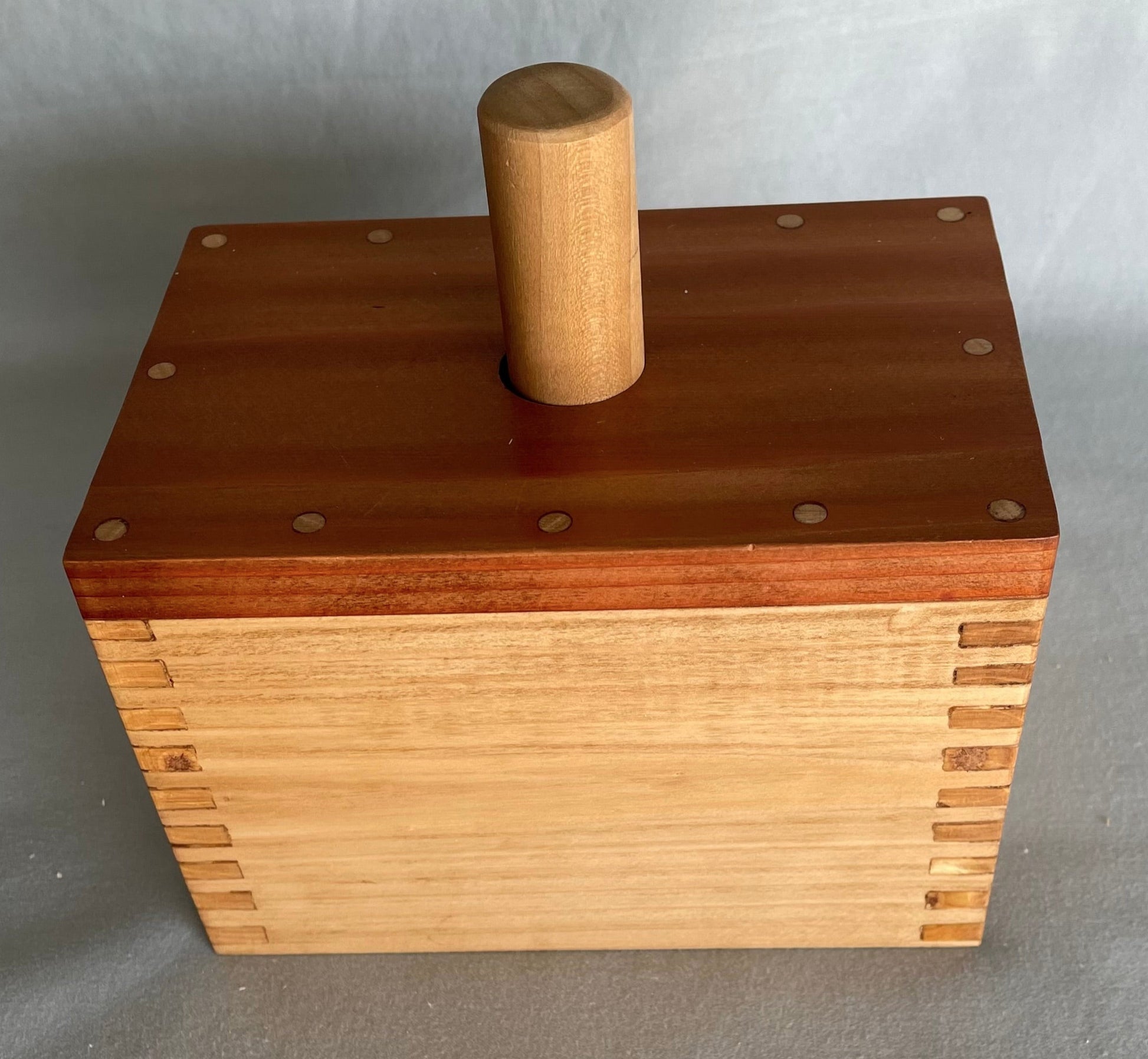 cedar top with dove tailed pine box and a pine paddle. Butter mold