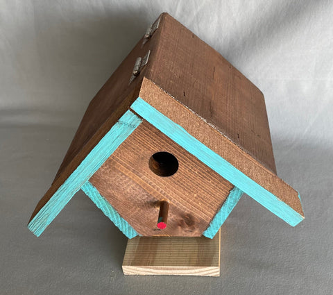 Wren Bird House Blue Accent Artist: Lester Dumm  7" x 9" x 6.5"  Hinged roof  Blue Accent  Why Boxes??? I don’t know why.  I like building boxes. I started to build boxes to practice getting things “square”. You would think that with all the fancy carpentry tools, that making a square cut would be easy. I struggle with everything that needs to have a square corner. 