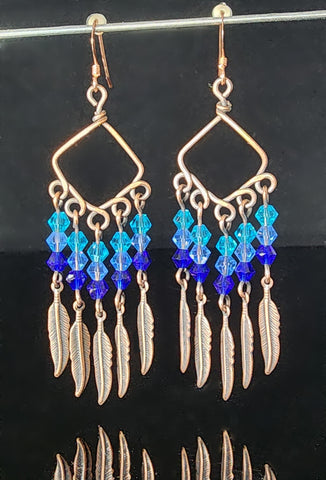 Blue Swarovski crystal beads on oxidized copper  Sterling Silver ear wires  2.72" long x  .93" wide  Long dangling earrings