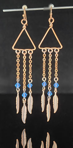 Blue Swarovski crystal beads on oxidized copper  Long copper chain with copper feather  Copper ear wires  3.42" long x  .79" wide  Long dangling earrings