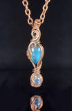 Labradorite and Moonstone in oxidized copper  1.66" Long x .33" Wide  Copper chain with lobster clasp closure  A beautiful delicate necklace for everyday use  Care instructions with polishing cloth included