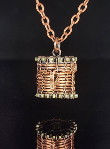 Hand woven oxidized copper wire  Small basket pendant that can be used with an essential oil bead (bead not provided)  87" long x .72" wide  Copper chain necklace with lobster clasp  Care instructions and cleaning cloth provided