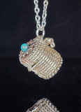 Hand woven silver colored artistic wire  Small basket pendant that can be used with an essential oil bead (bead not provided) or carry a small memento  Small turquoise bead on the top of the box  .8" long x .76" wide  Silver colored chain necklace with lobster clasp  Care instructions and cleaning cloth provided