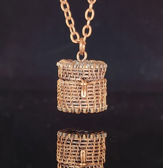 Hand woven oxidized copper wire  Small basket pendant that can be used with an essential oil bead (bead not provided)  .8" long x .7" wide  Copper chain necklace with lobster clasp  Care instructions and cleaning cloth provided