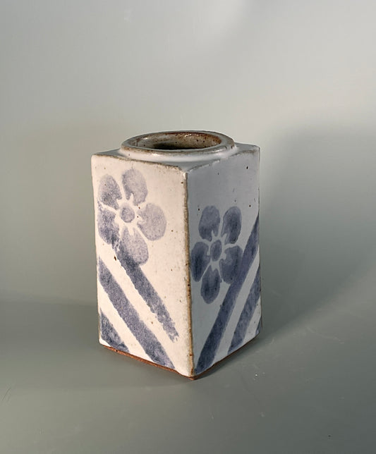 Hand thrown Slab work stoneware vase  Gray glaze and blue Flower pattern  Blue stripes on every side in the left hand corner 