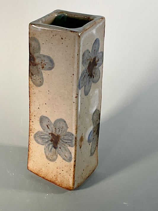 Hand thrown stoneware slab vase  Light blue flowers on each side  Squared vase with round opening